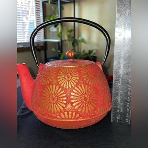 Japanese cast iron tea pot, orange-reddish with gold accents